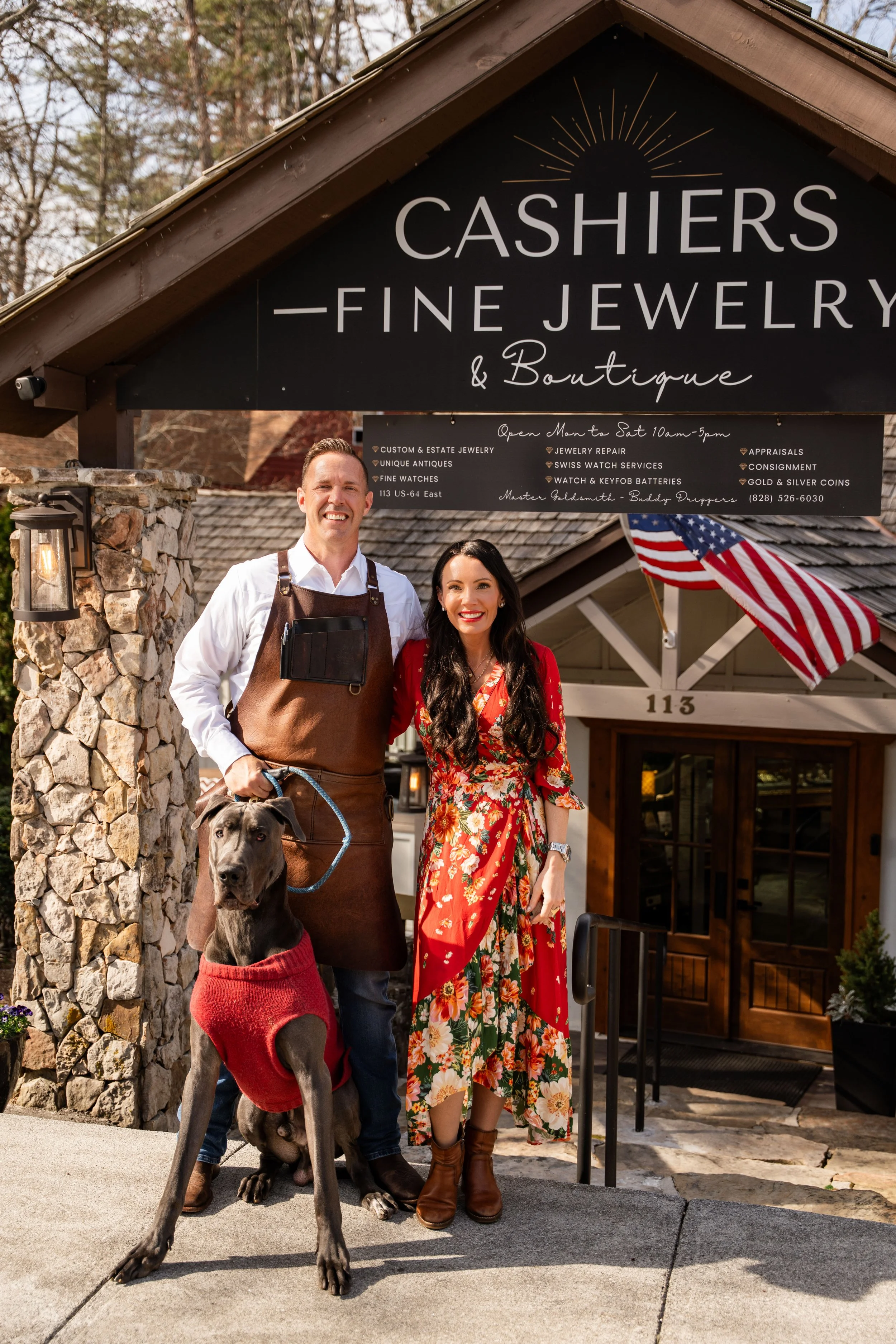 Buddy and Serena Driggers standing in front of Cashiers Fine Jewelry sign