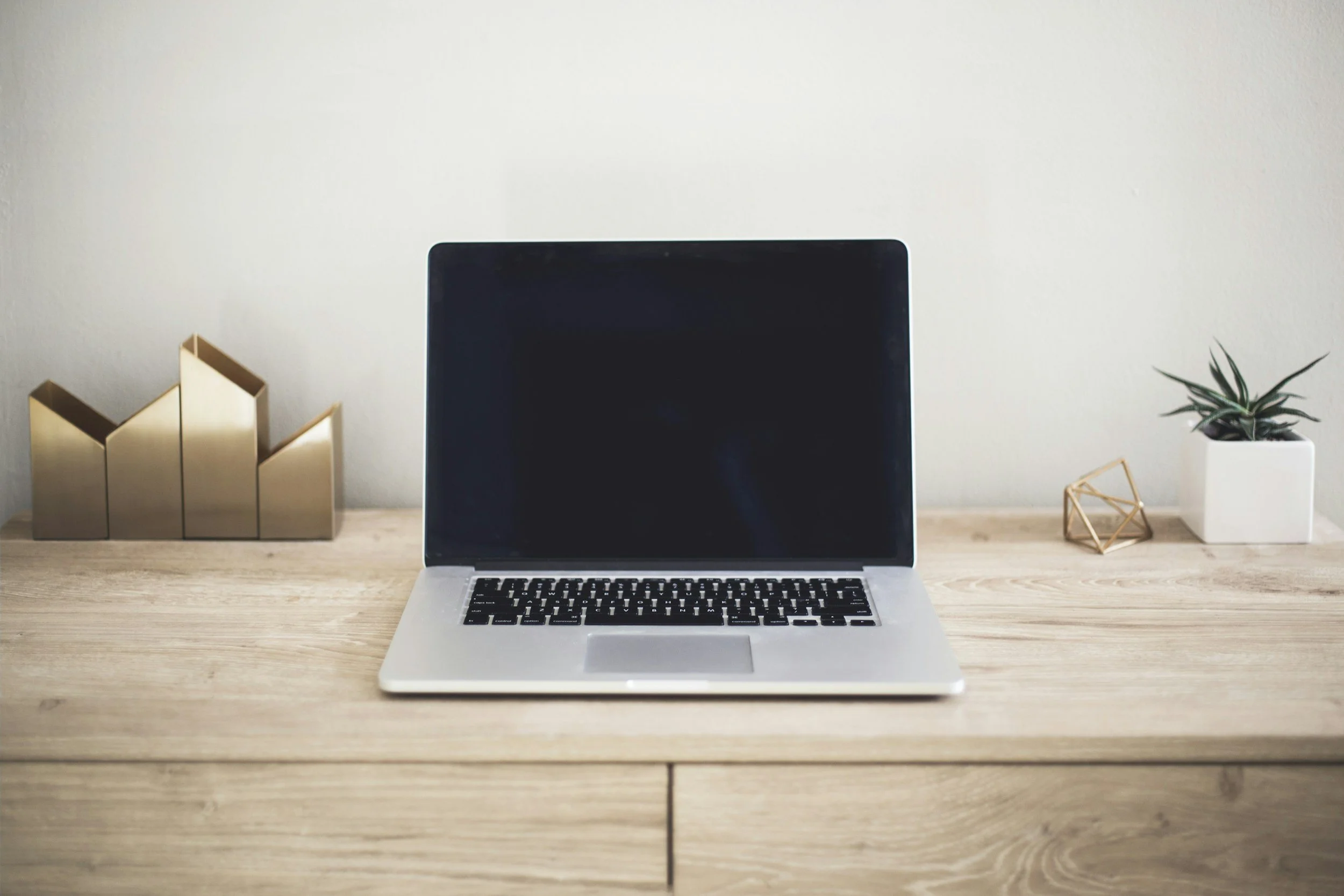 Laptop on a wooden desk, a typical workspace for desk and screen time