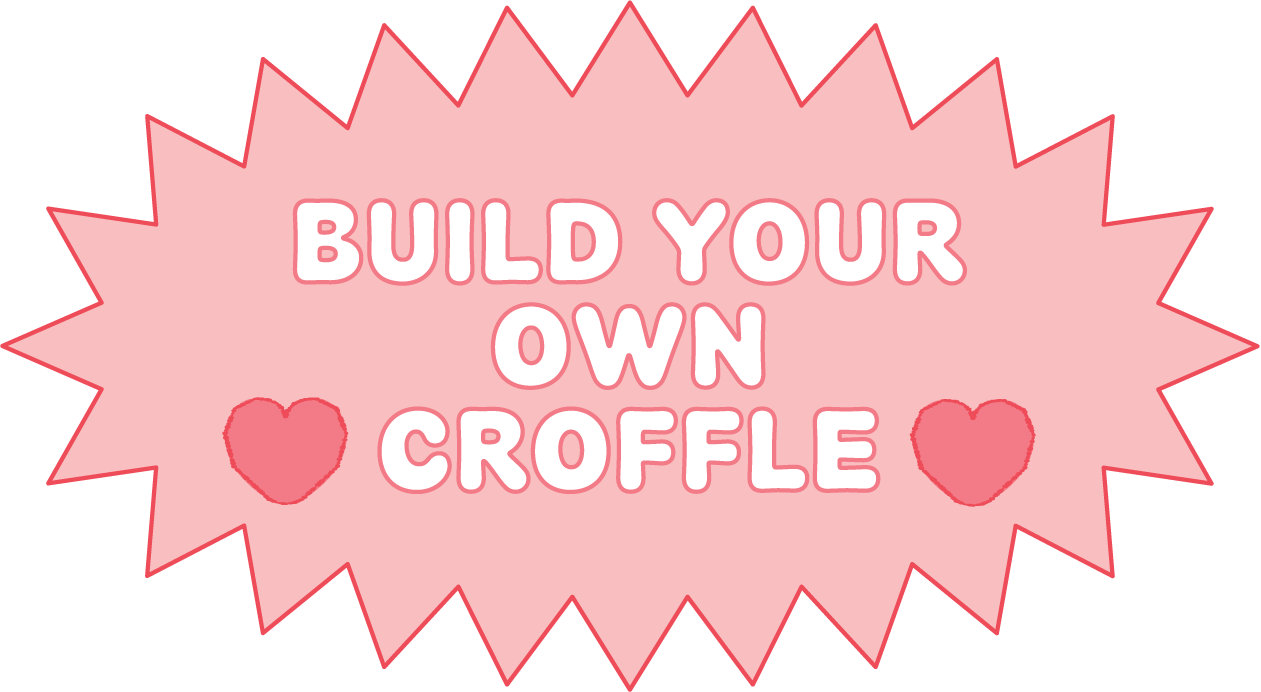 Pink starburst-shaped sign with white text that says "Build Your Own Croffe" and two red hearts.