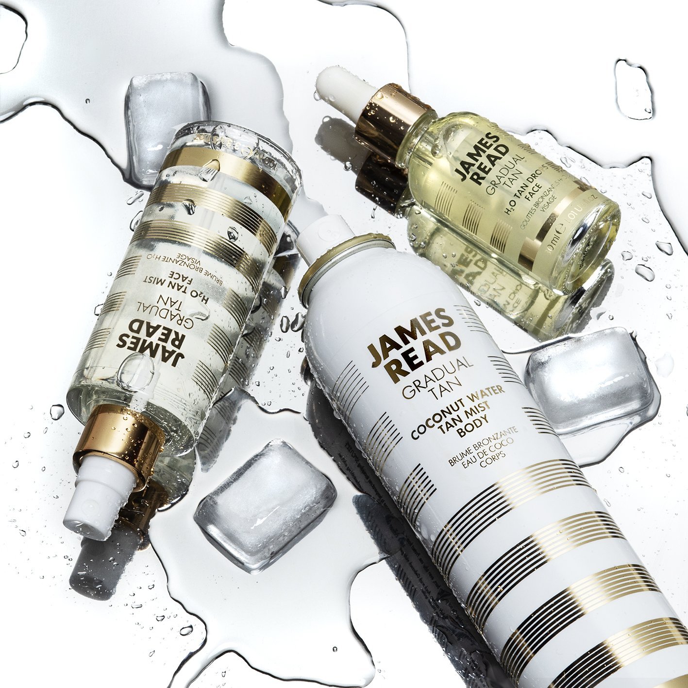 Creative product shot group on mirror surface with ice and water for James Read tanning products by Shutters Photography