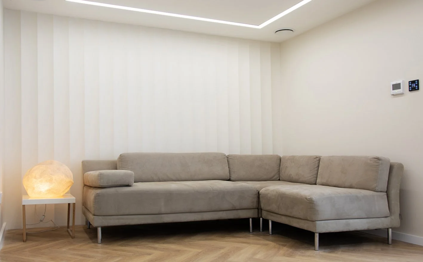 lounge section featuring a custom fluted wall and modular sofa at Shutters Studios West London