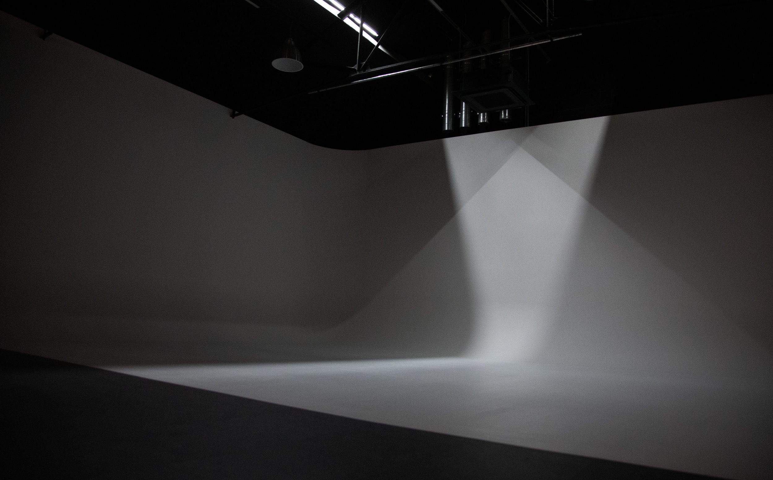 near blackout over luxury, heated cyclorama wall in Acton, West London