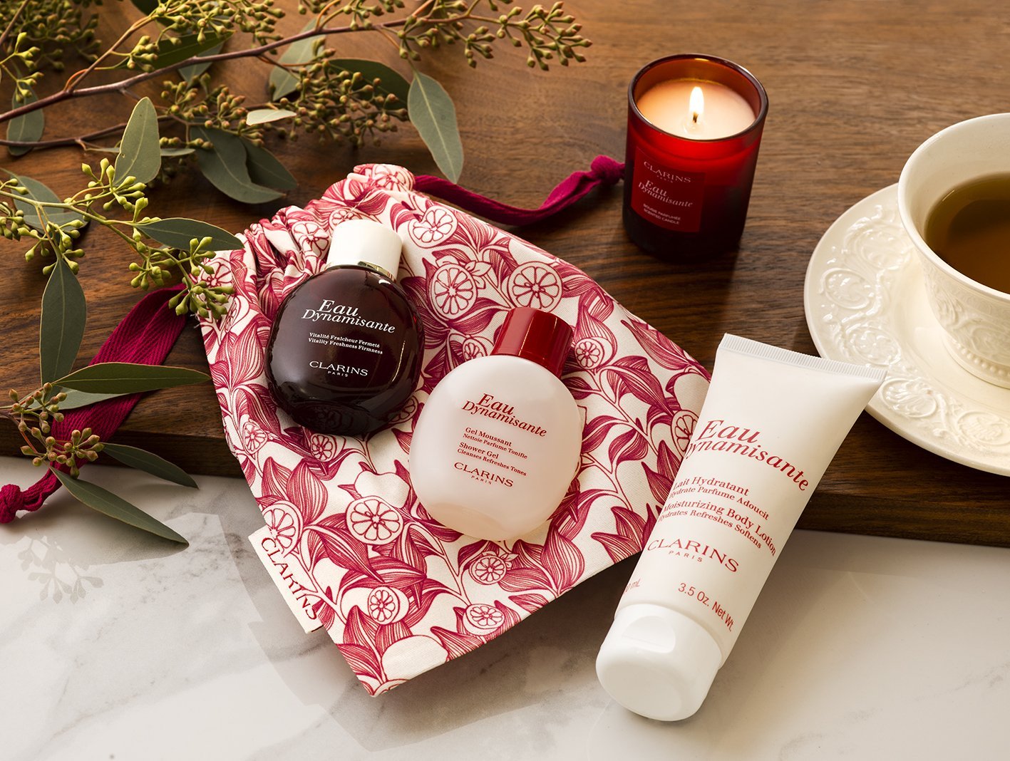 A relaxed overhead view of a budle of GWP items for Clarins by Shutters Photography