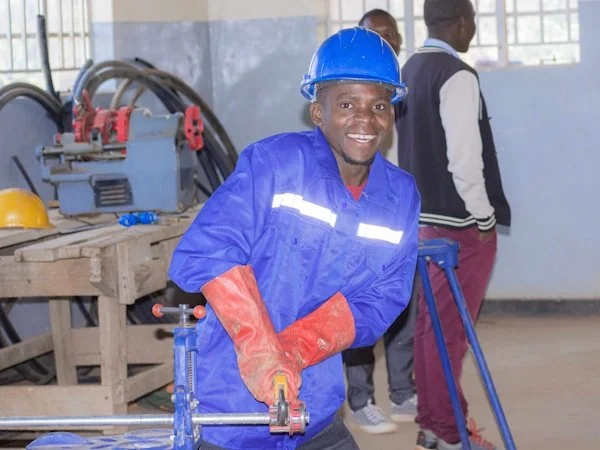  A plumbing student during a workshop session doing practical training. 