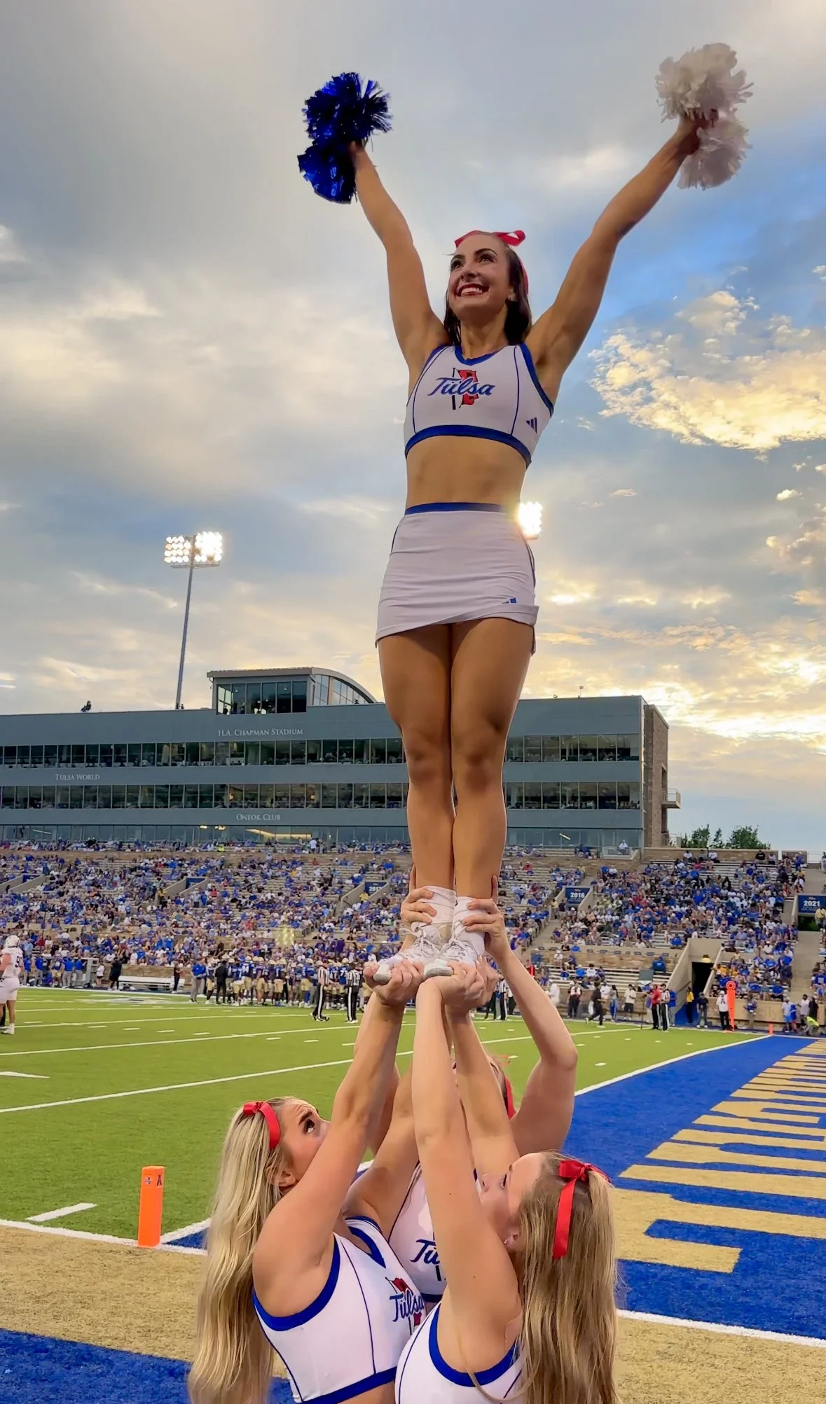 Tulsa cheerleaders on the football field
