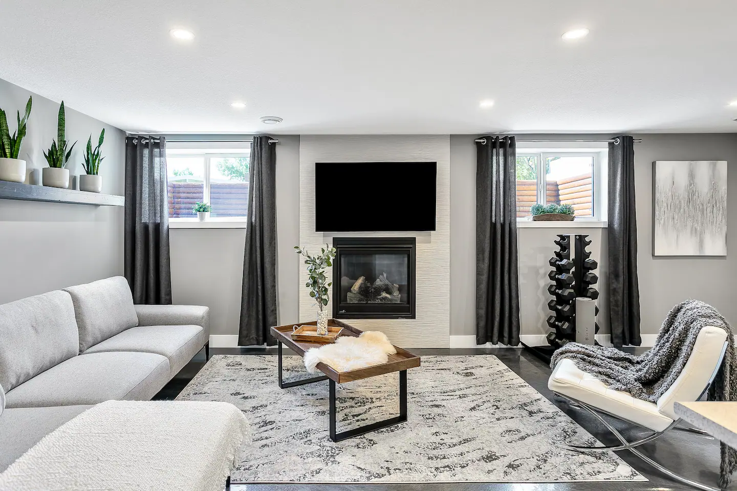 Basement suite living room with large and bright windows.