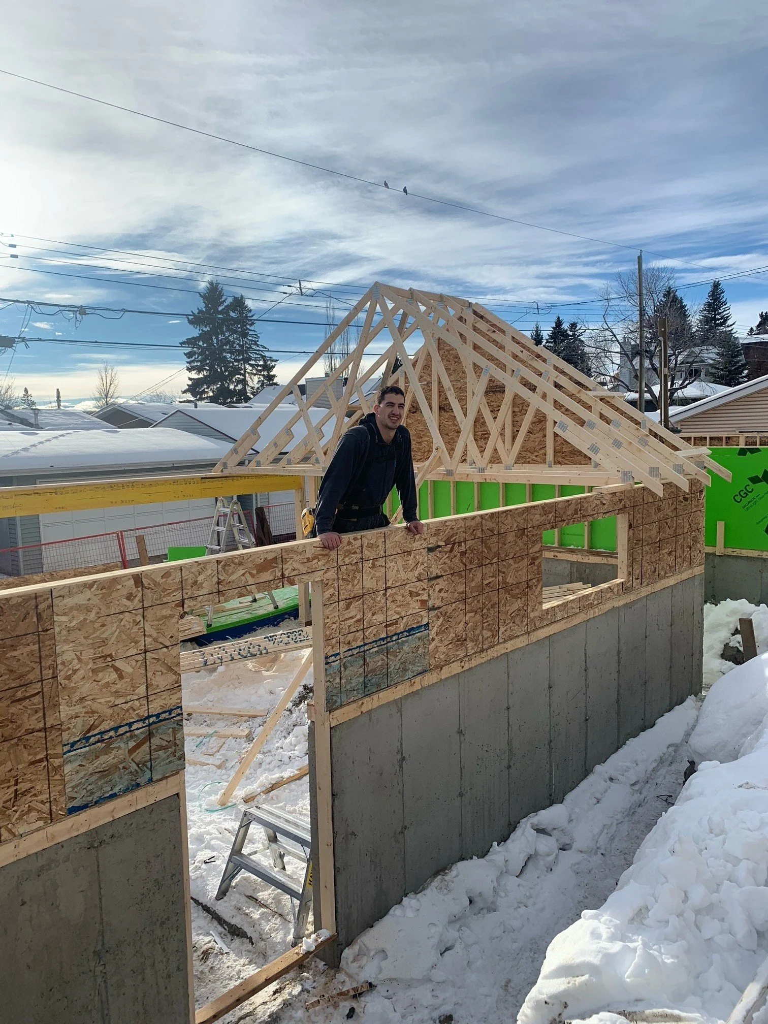 Worker standing inside partially constructed suite