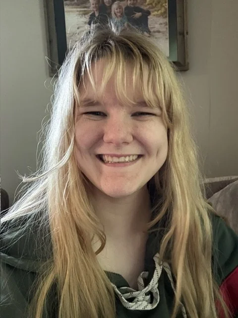 Ellie Smith (she/they) grew up in northeast Iowa and lives in Iowa City, Iowa. They attend college at the University of Iowa, where she is majoring in History and Political Science and minoring in Korean.

Ellie loves listening to music, specifically