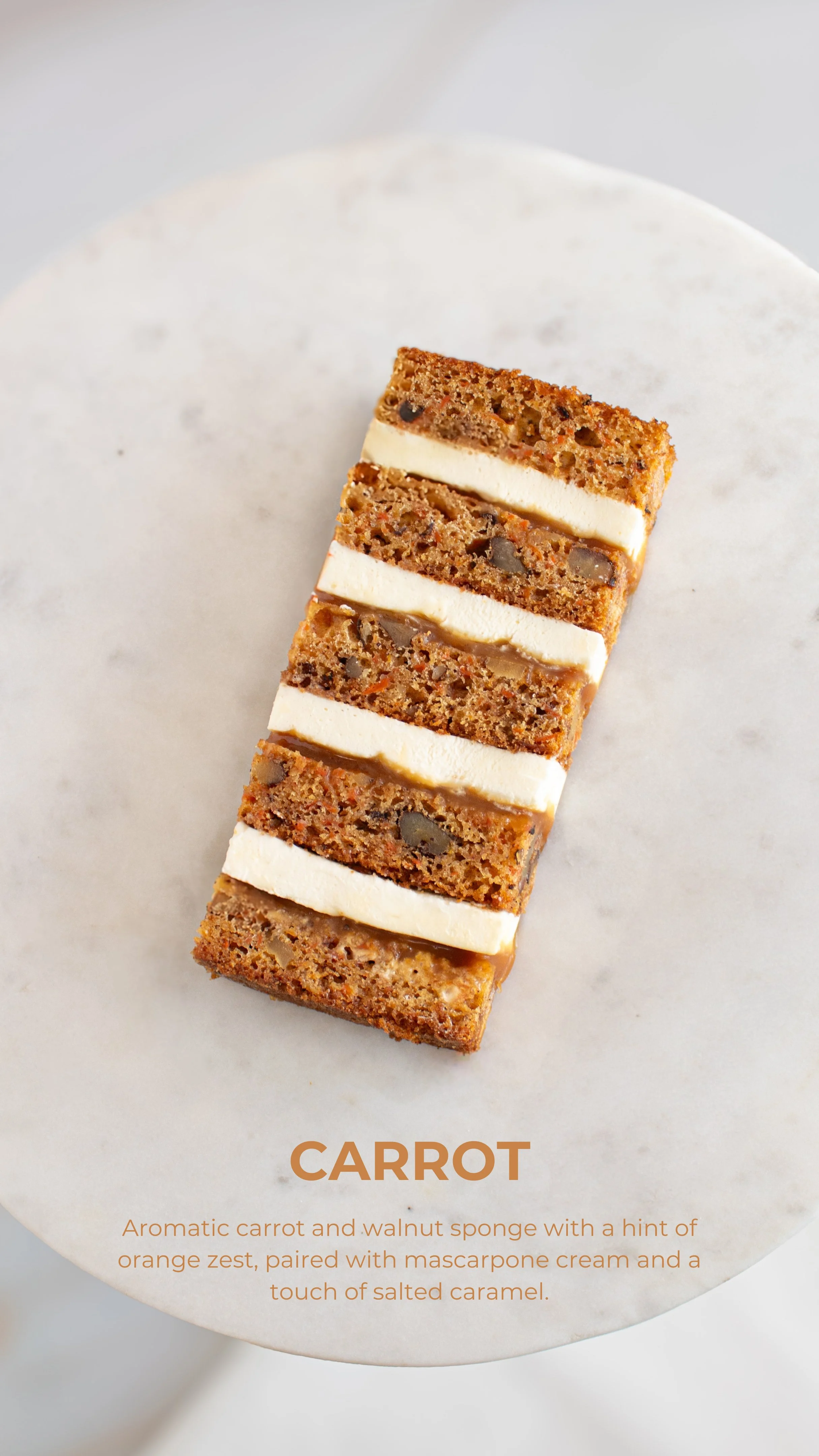 Slices of carrot cake with walnuts, orange zest, mascarpone cream, and salted caramel on a white plate.