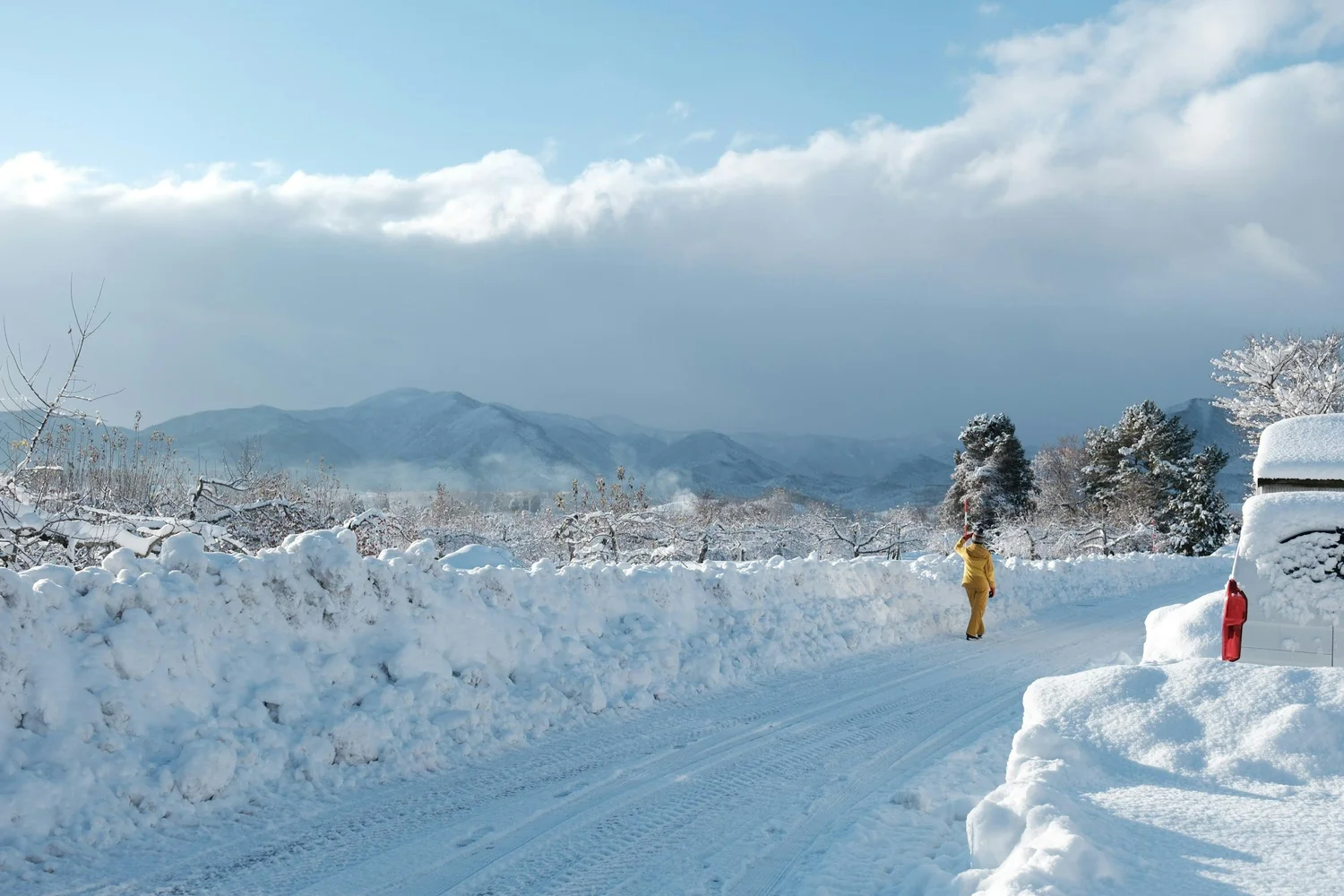 Snow covered road being cleared during a Bend, Oregon winter