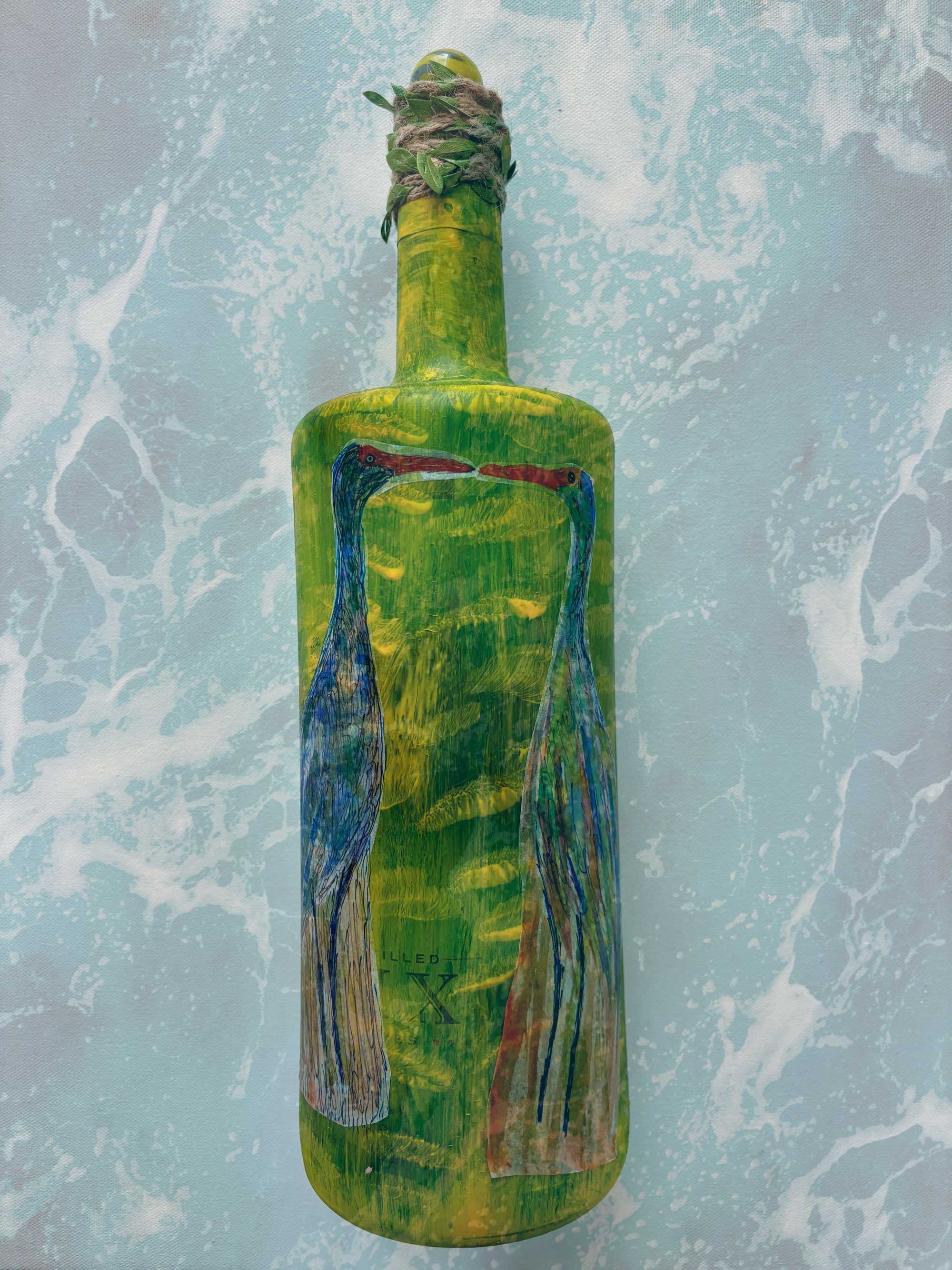green-bottle-with-bird-artwork.jpg