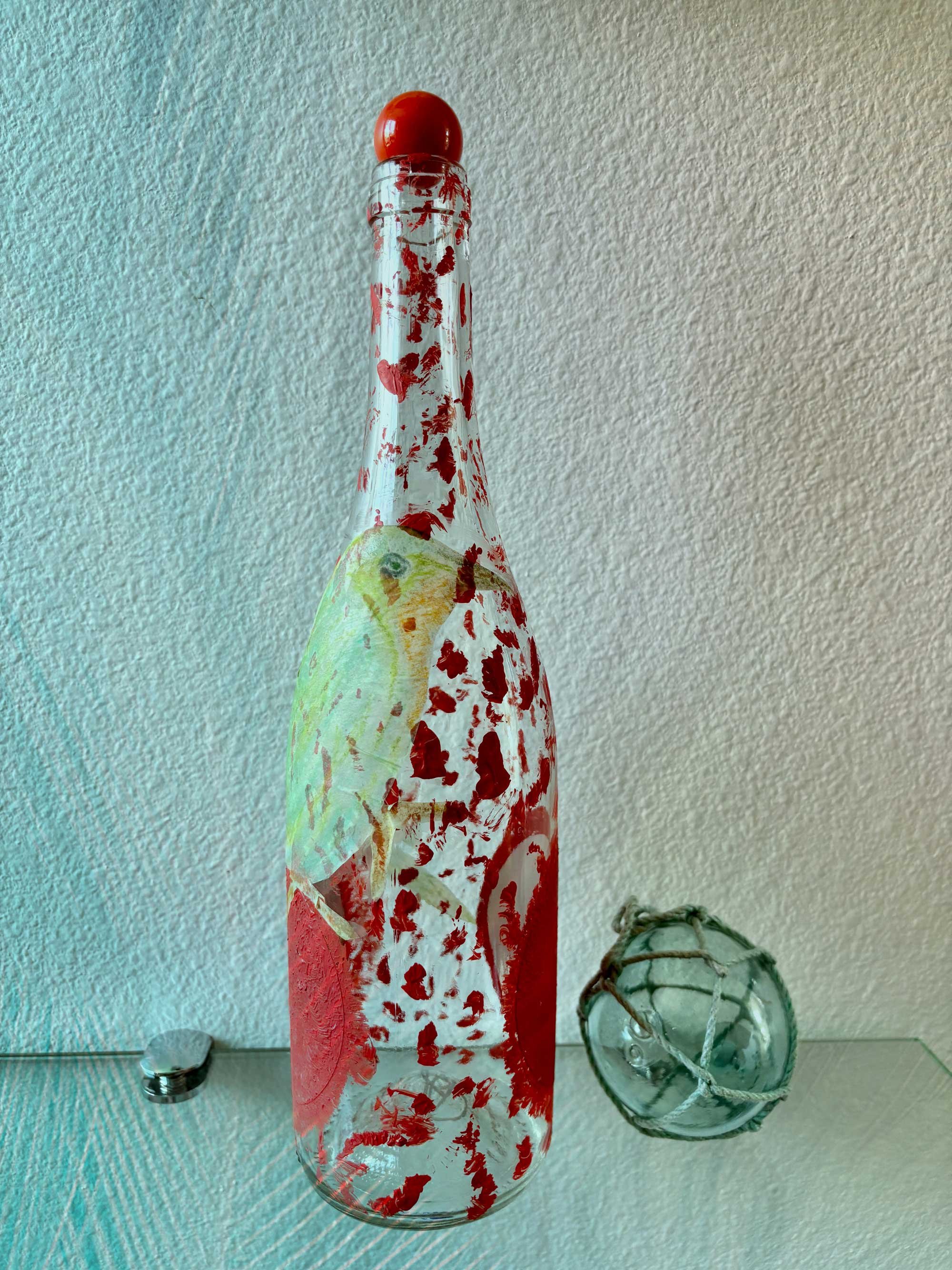 red-and-white-bottle-with-bird-artwork.jpg
