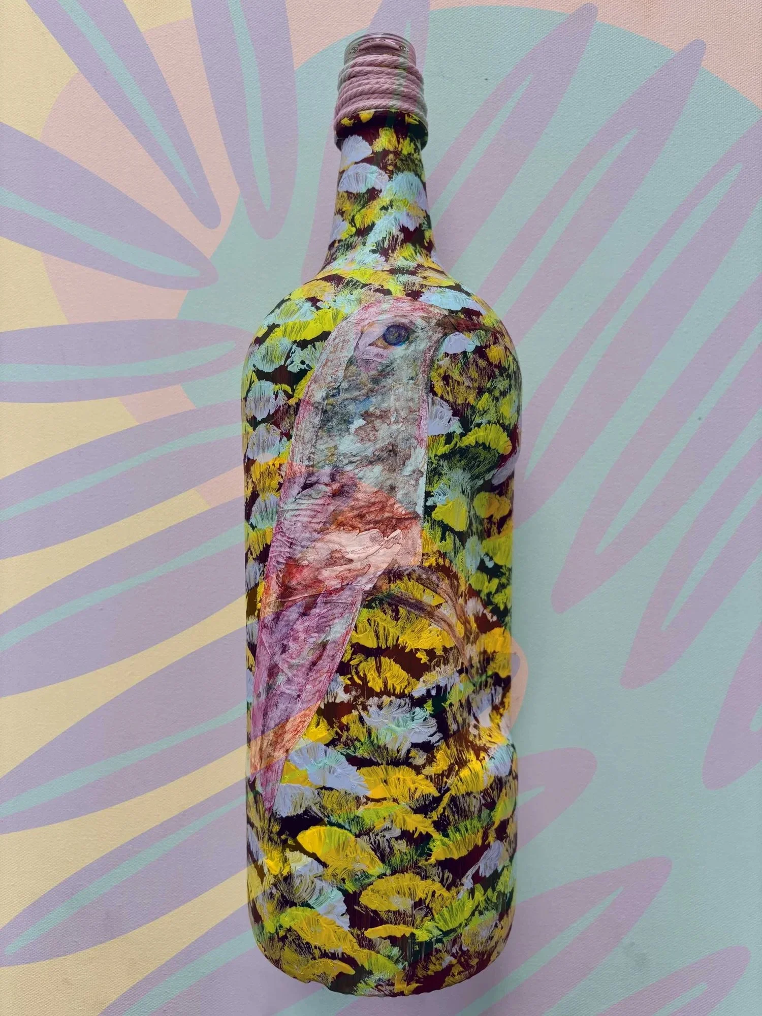 bottle-with-brush-strokes-and-bird-artwork.jpeg
