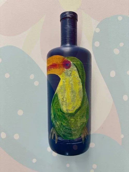 blue-bottle-with-toucan-bird-artwork.jpeg