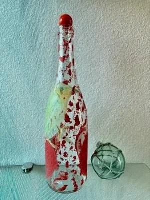 red-and-white-bottle-with-bird-artwork.jpeg