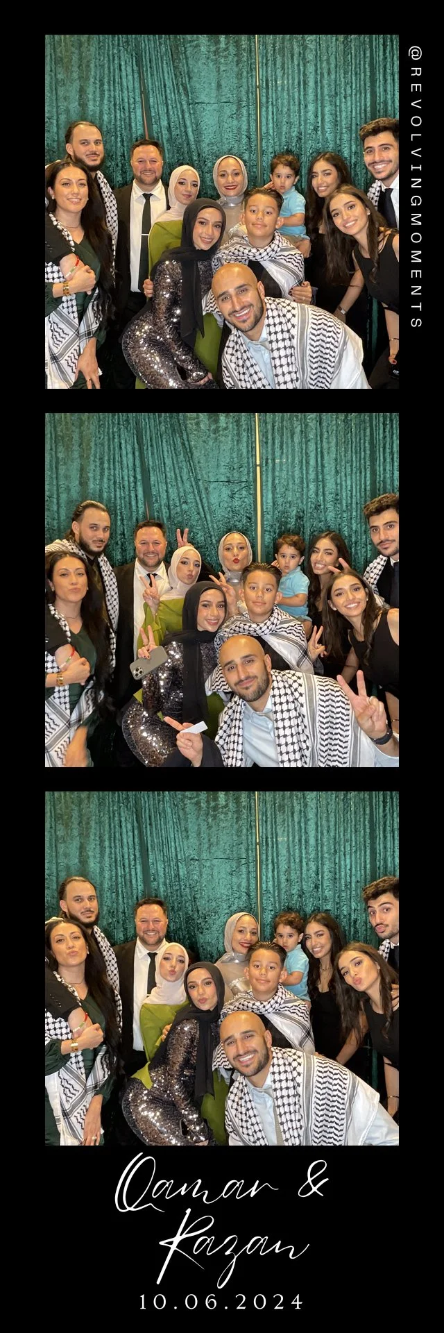 A group of people, including men, women, and children, posing for photos against a green curtain backdrop. Some are making peace signs or gestures, and a few are wearing traditional Middle Eastern attire, such as keffiyeh scarves. The event appears t