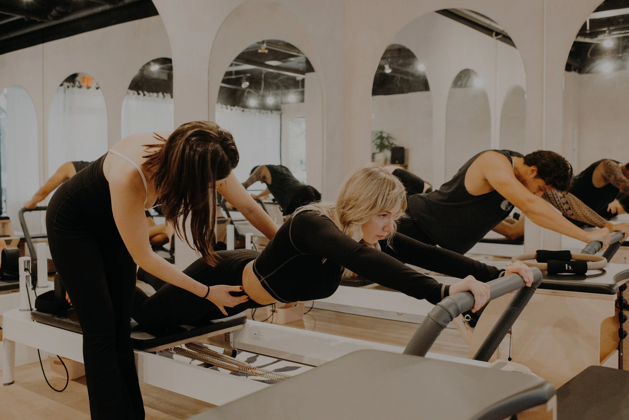 Group reformer Pilates class at Adoro Pilates studio in Maple Ridge