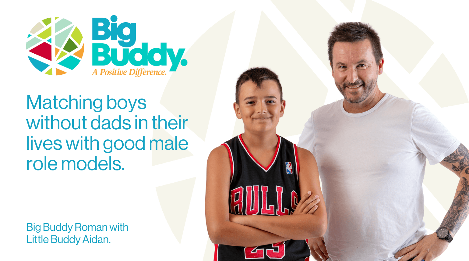 A promotional image for Big Buddy shows a smiling young boy standing next to an adult man, both with arms crossed. The boy wears a basketball jersey with the Chicago Bulls logo, and the man has tattoos on his arm, a beard, and wears a white t-shirt. The background features a white and light gray geometric pattern, and the logo for Big Buddy is in the upper left corner along with text promoting role models for boys.