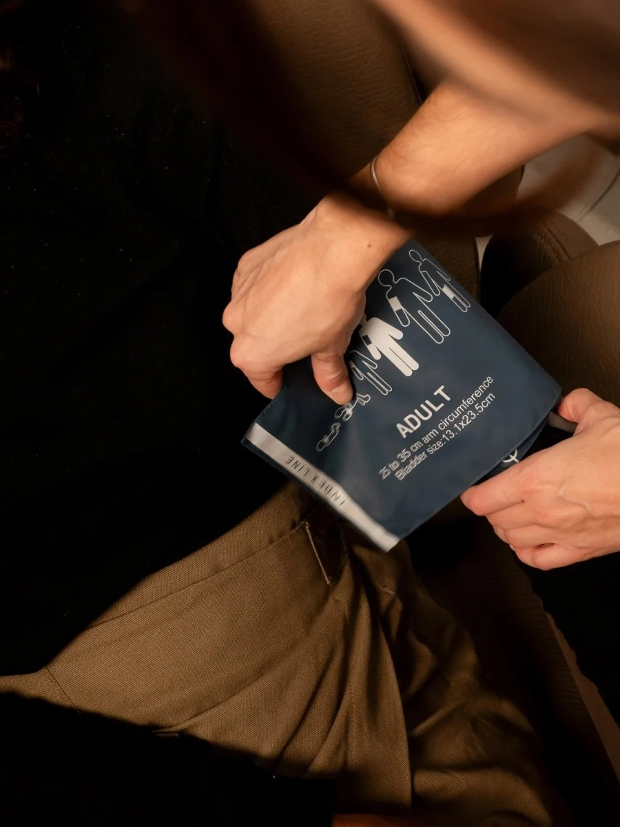 A nurse measuring the pressure of a woman