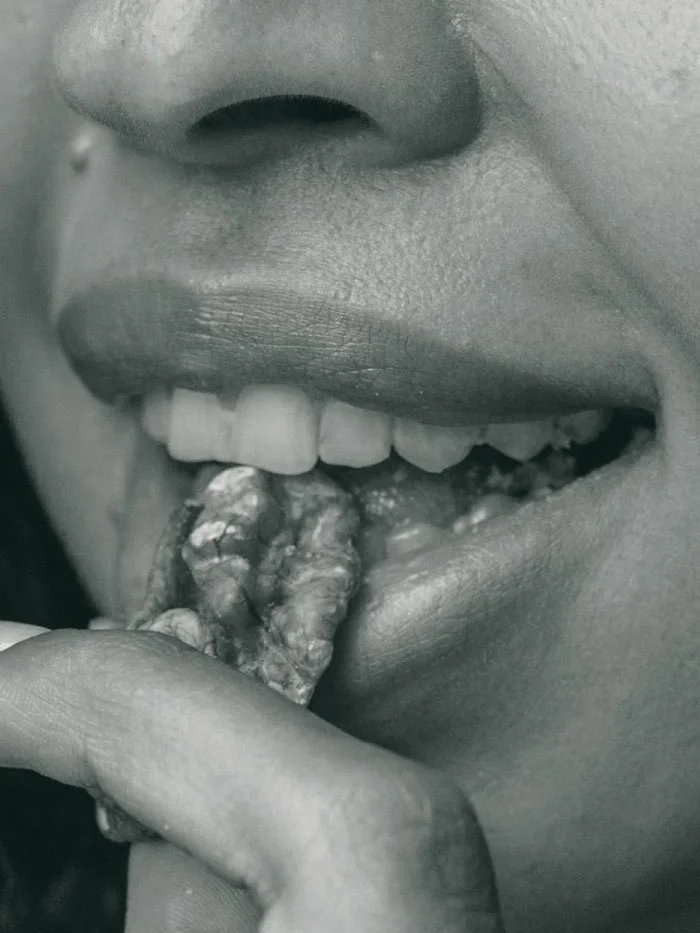 Two woman hands holding a smart phone with a health app. in a warm cozy light