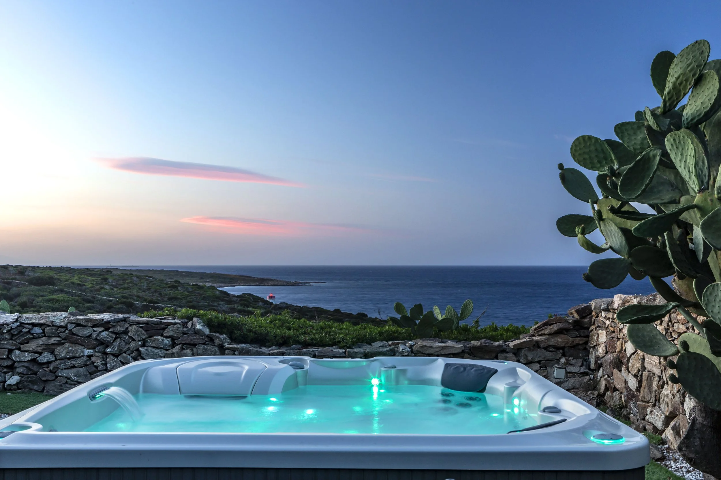 spa views of Mediterranean sea with lighthouse in Costa Smeralda, in Sardinia