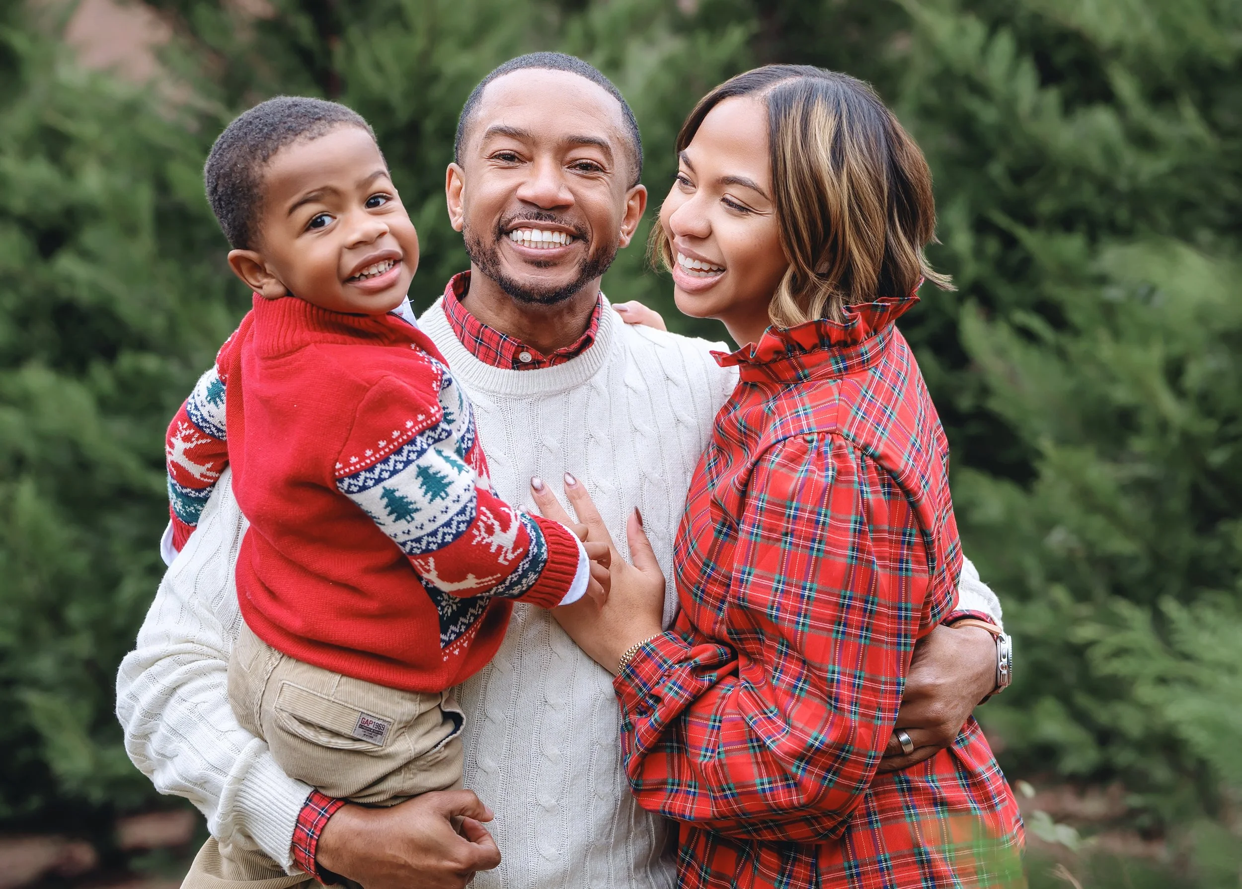 FAMILY OF 3 ENJOYING A MOMENT OF HAPPINESS TOGETHER