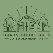 Logo for Hunts Court Huts at Cotswold Glamping featuring a tent with two trees and the sun shining.