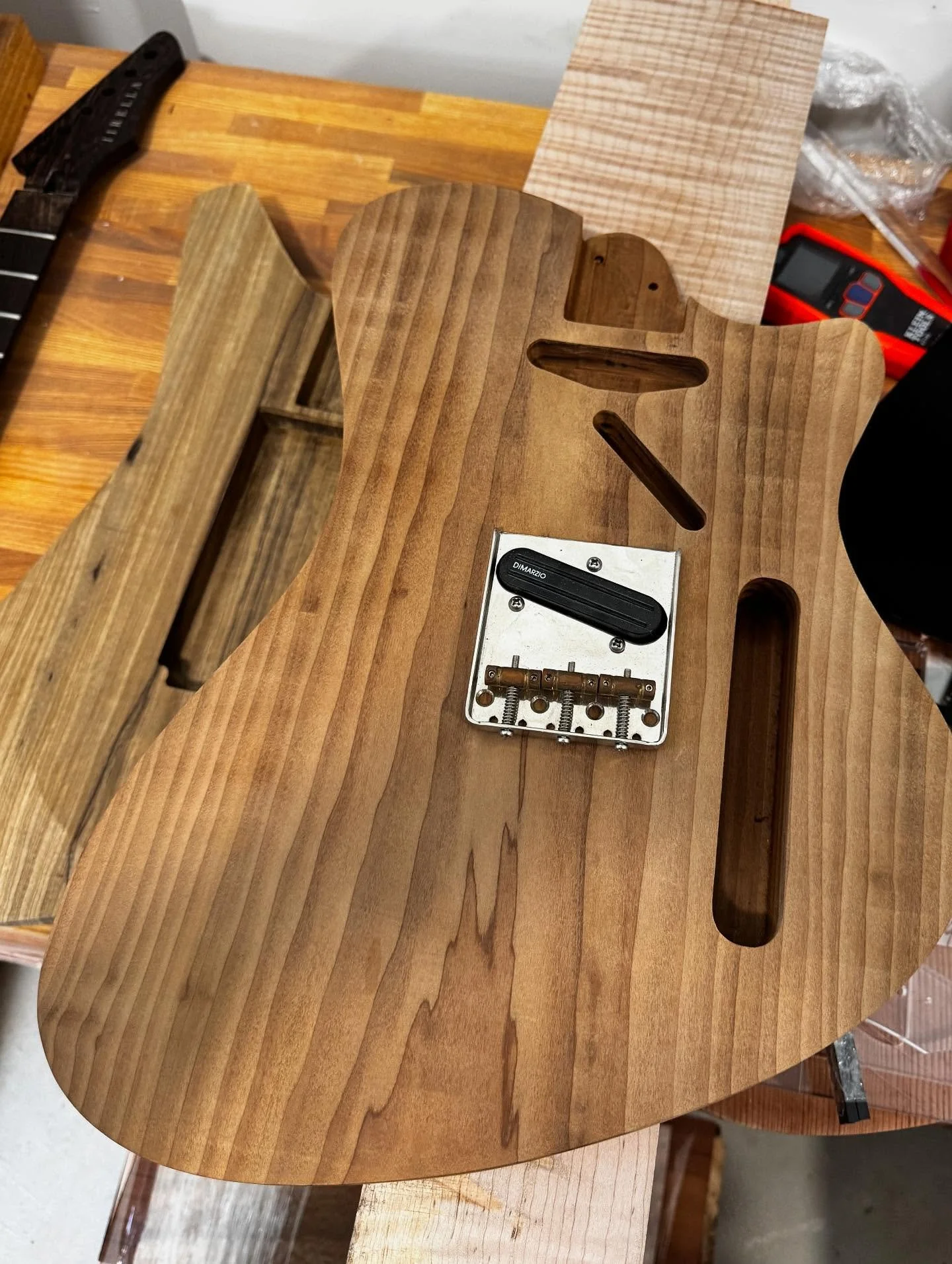 Finally getting to some projects I&rsquo;ve been slacking on, tele spec Wayfinder, 30 inch Outrider, semi hollow Wayfinder with flame black limba body and one piece curly redwood top.
