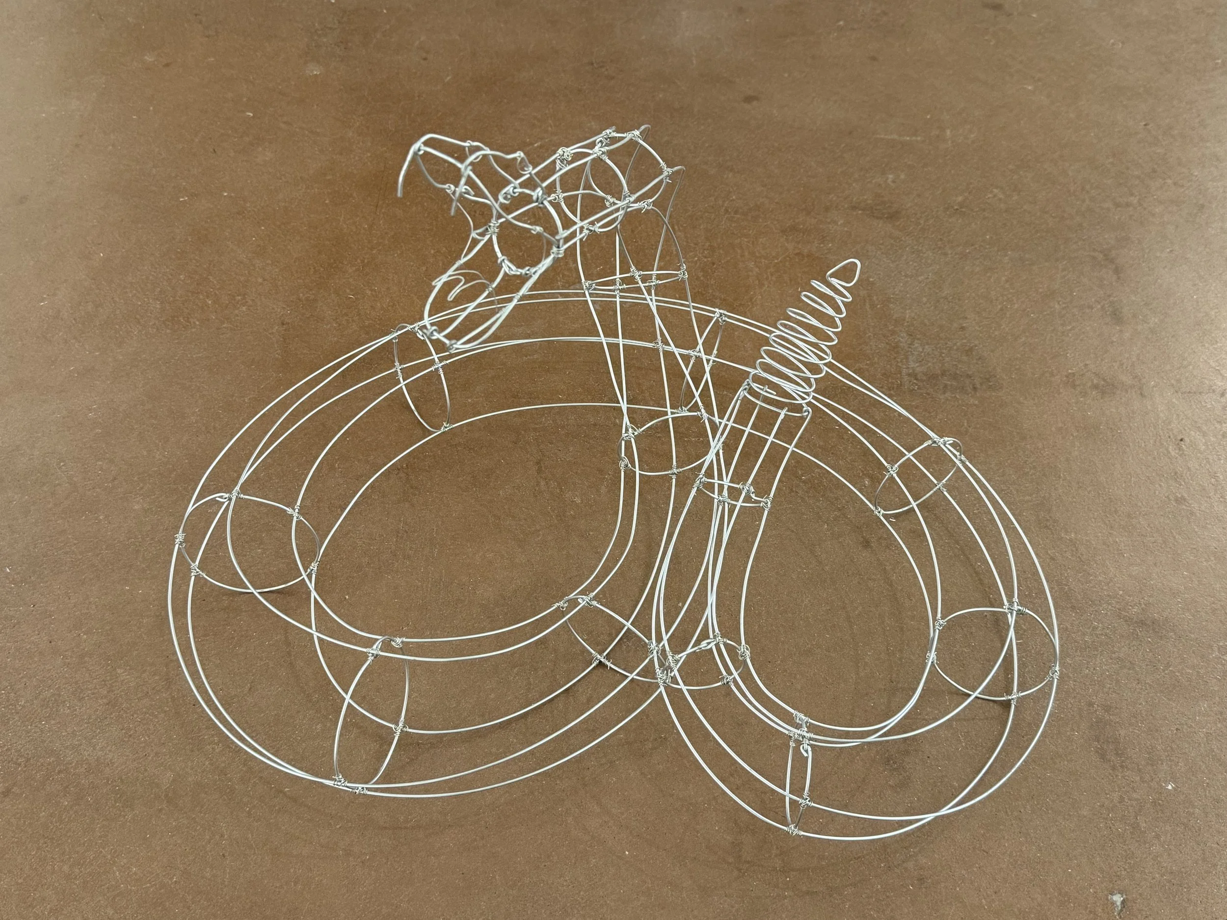 "Once Bitten, Twice Shy." Wire Rattlesnake. 15" x 22" x 12". 2023.