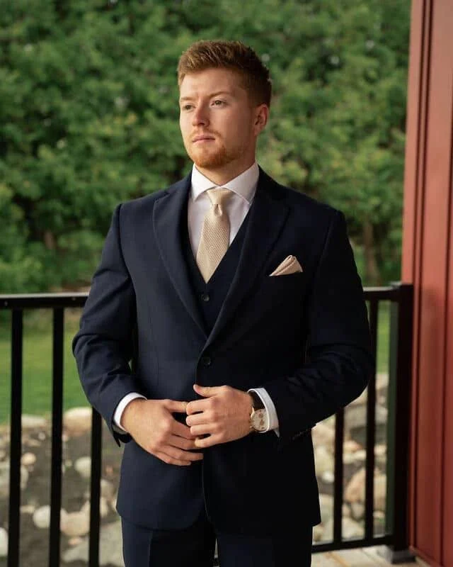 When the groom looks this good in his suit, the only two words you have to say is &ldquo;I DO&rdquo; 

Giorgio Fiorelli navy suit and vest
Finished with a limestone tone-on-tone tie and pocket square