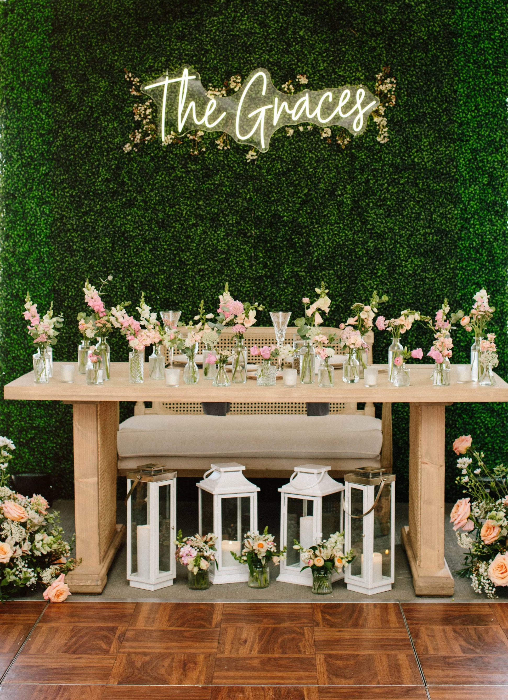 Elevated head table display and decorations at wedding reception. 