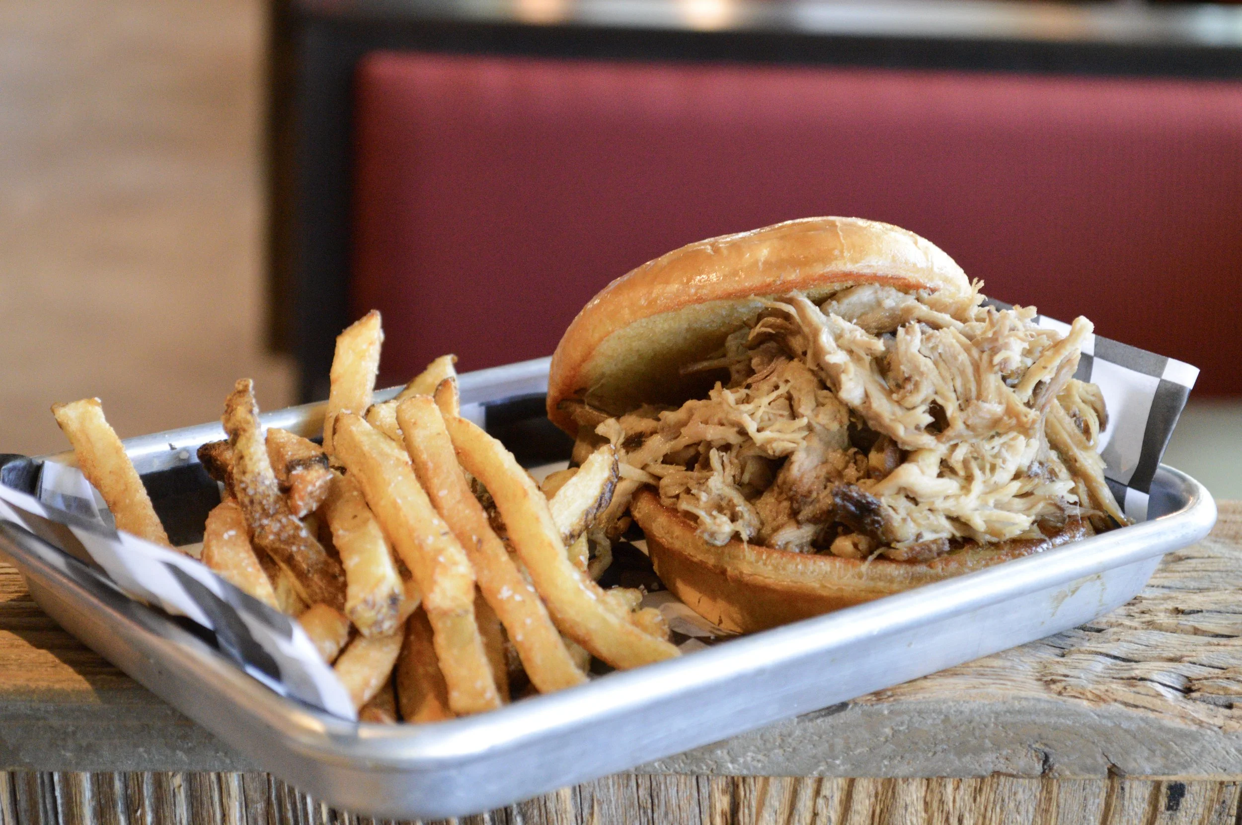 pulled pork sandwich with side of fries