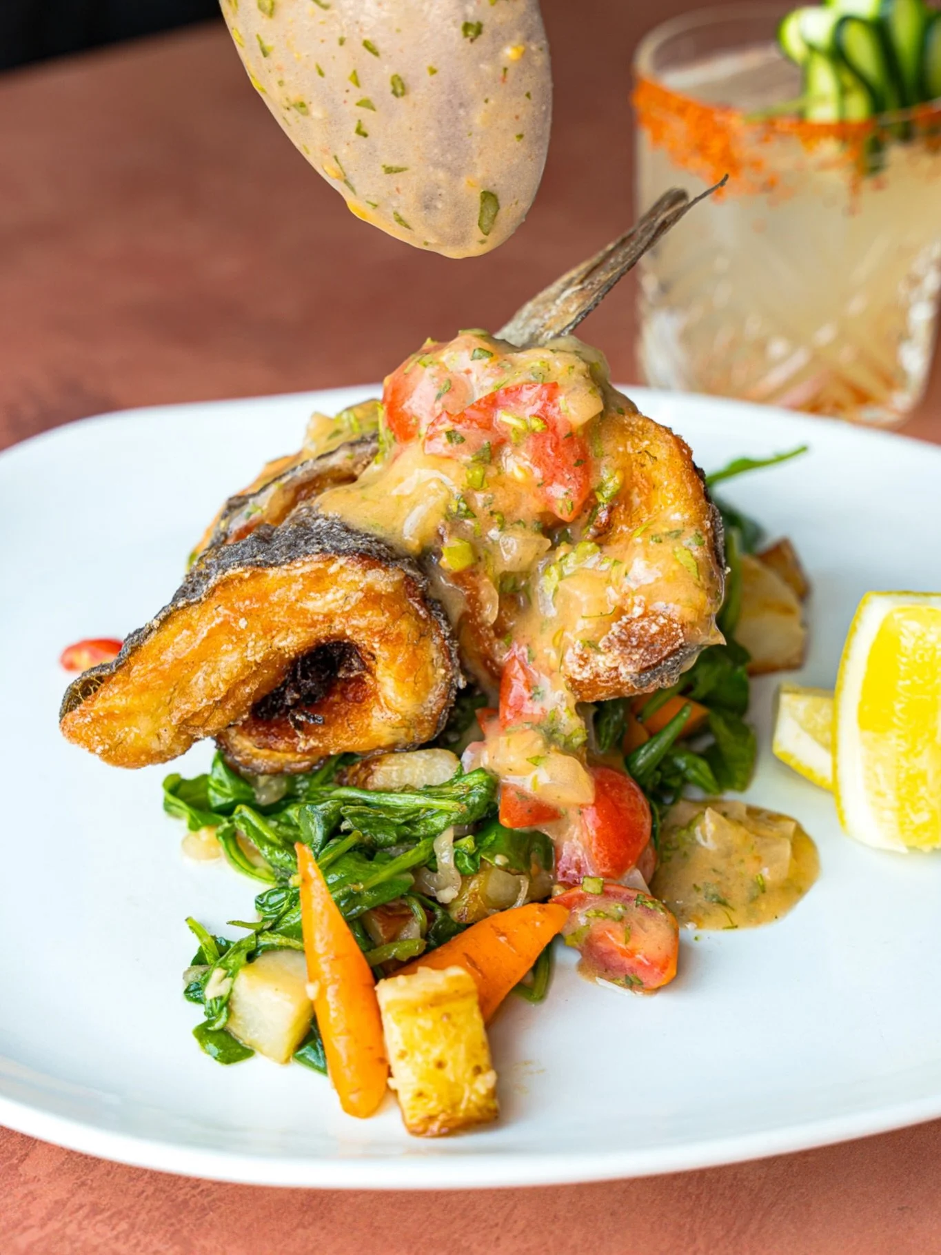 Discover a guest favorite: Whole Branzino&nbsp;🐟 beautifully crisp, elegantly balanced with Fennel Slaw, Tomato Gremolata, Baby Carrots, Greens &amp; Salted Yukon Potatoes.