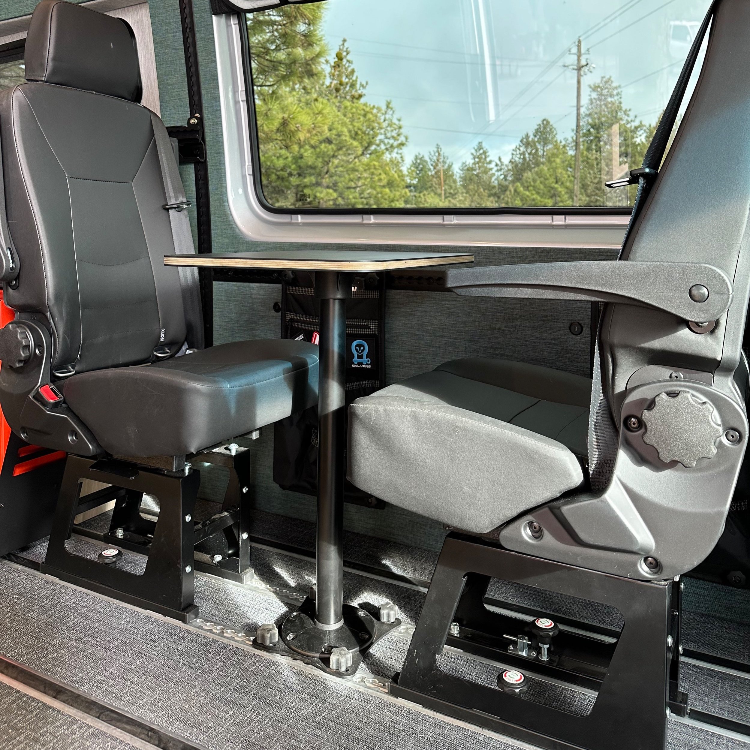 SmartFloor installed with Scheel-mann seats mounted to L-track; one seat swiveled to face the other seat.