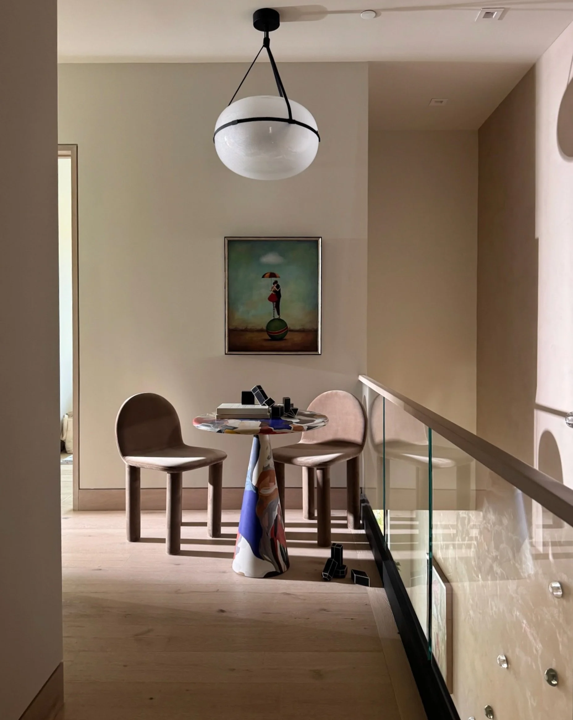 A table for two at the top of the stairs.

#winslowhouse #coloradointeriordesign #tablefortwo #staircaselanding #pendantlight