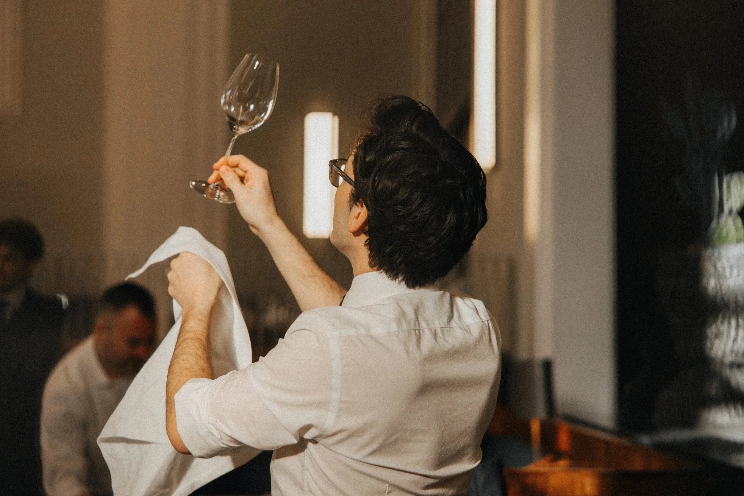 Sommelier+Cleaning+Wine+Glass.jpg