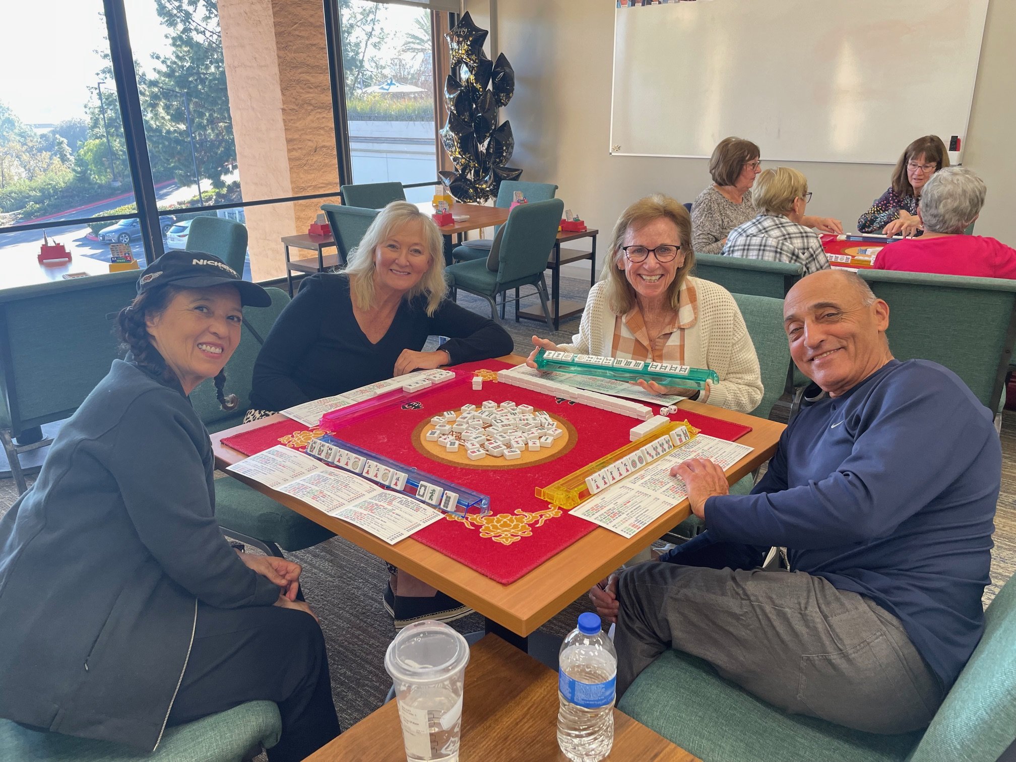 Beginners American Mahjong class, San Diego. Co-workers playing Mahjong at an office Mahjong class