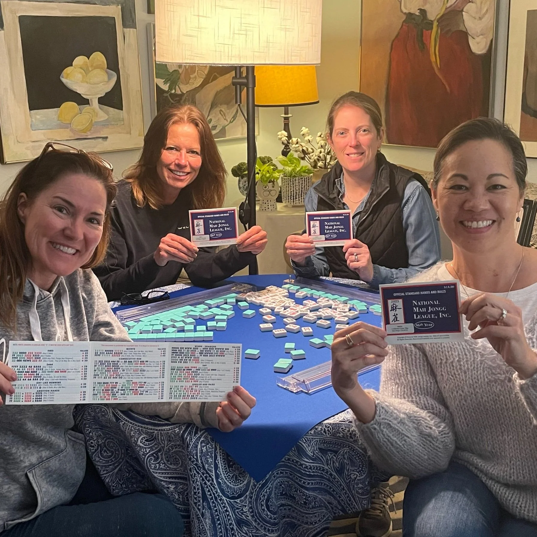Beginners American Mahjong class at Scripps Ranch, San Diego, holding up their 2025 cards.