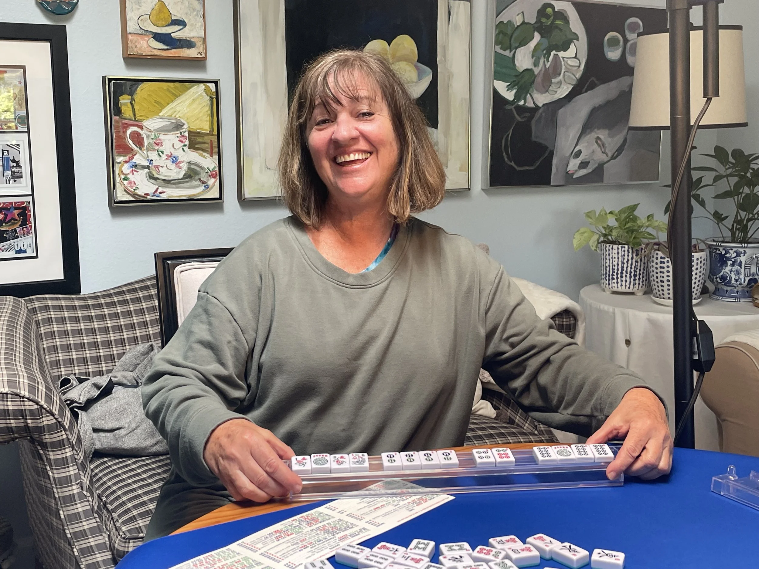 Beginners American Mahjong one-on-one class at Scripps Ranch, San Diego. Woman showing her winning Mahjong hand.