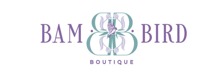 Logo for Bam Bird Boutique featuring stylized floral designs and purple text.