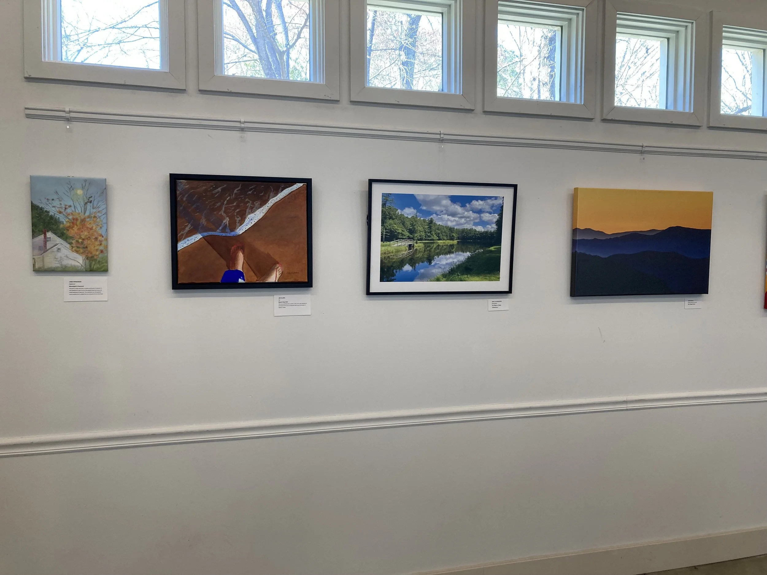 Art Show 2025 Paintings on left wall.jpg