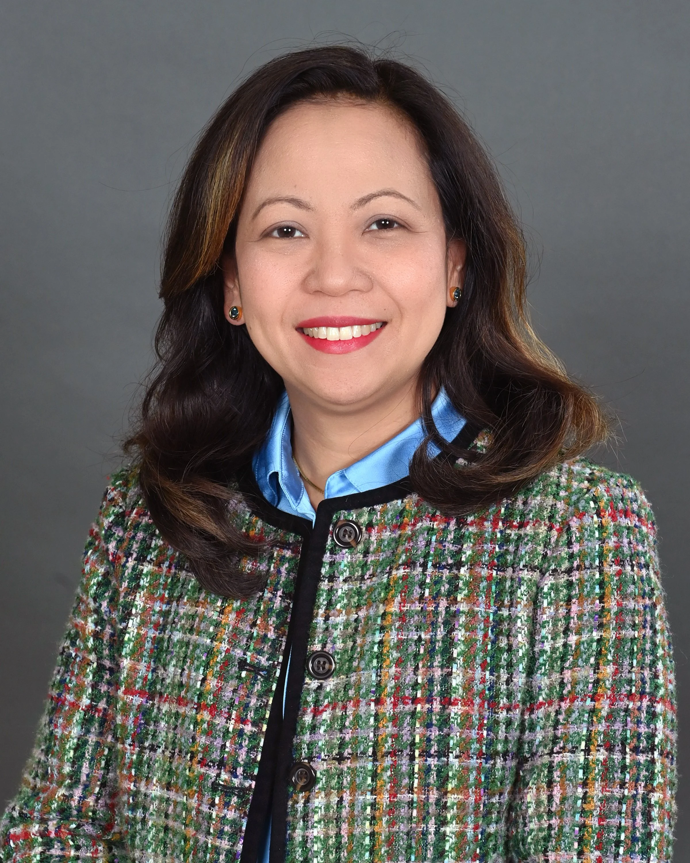 A stylized profile of a person with glasses and wavy hair, surrounded by a circular border with English and Latin text 'CULTURA VITAE' and decorative laurel branches.