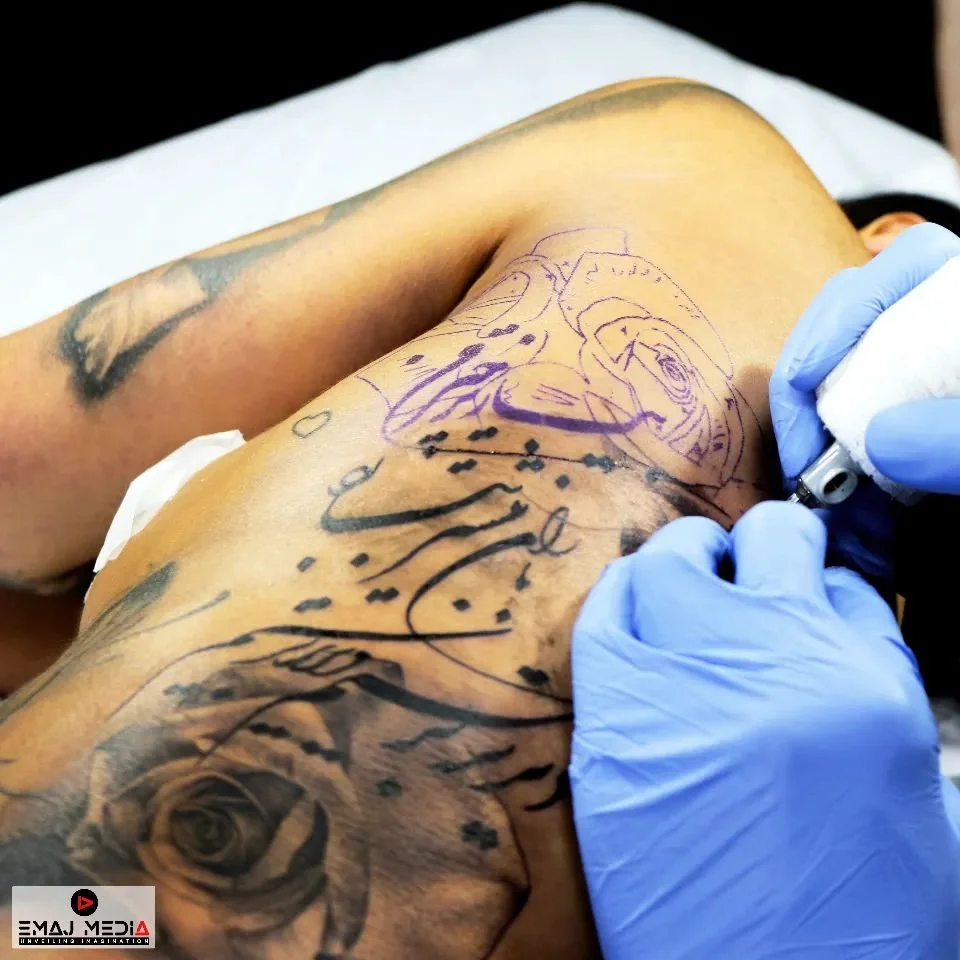 EMAJ MEDIA 
Presenting traditional calligraphy as a tattoo artistic design through video highlights the fusion of ancient craftsmanship with modern body art, showcasing the elegance and cultural significance of each stroke. This visual storytelling m