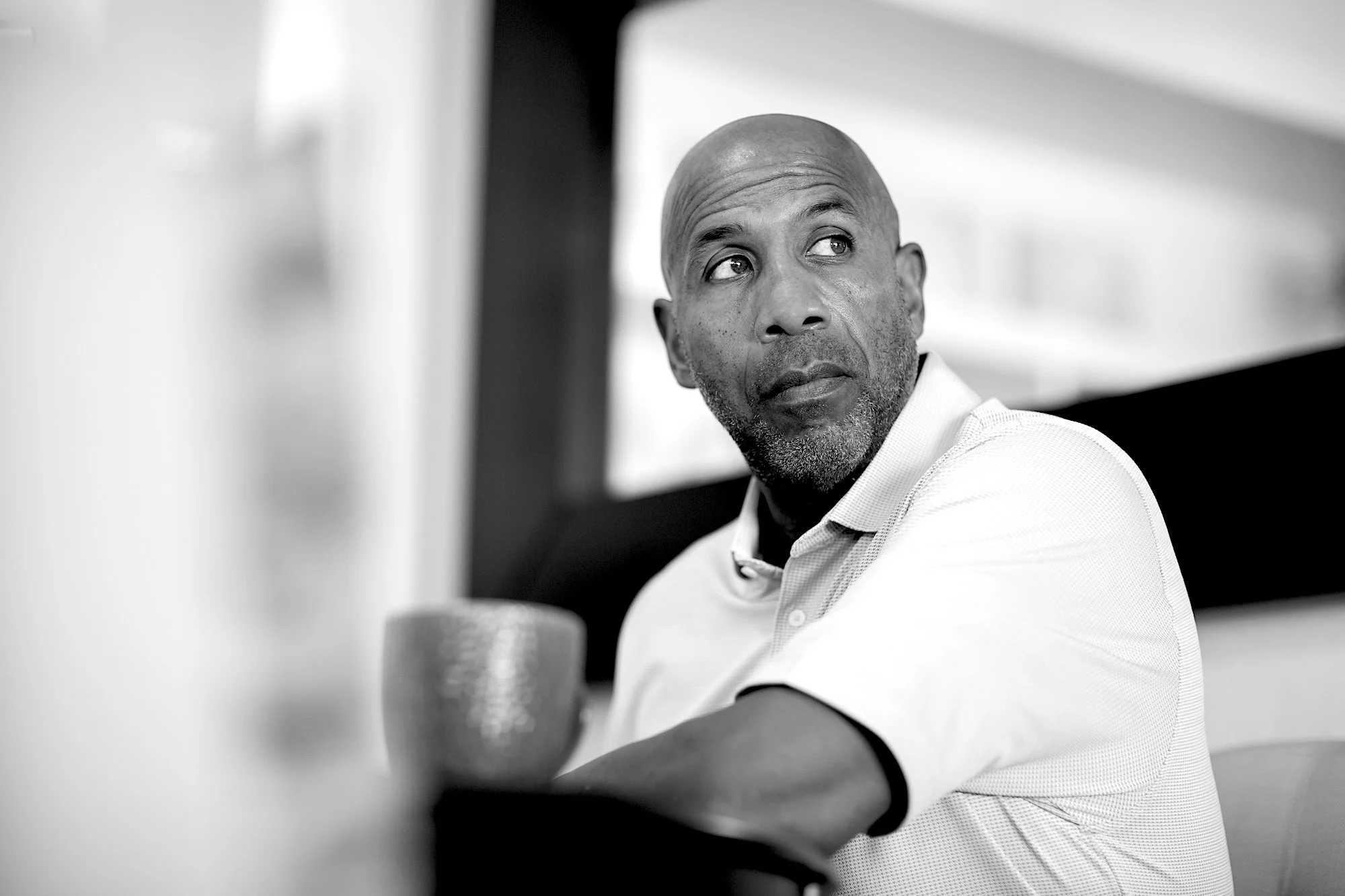 A male CEO contemplating succession planning.
