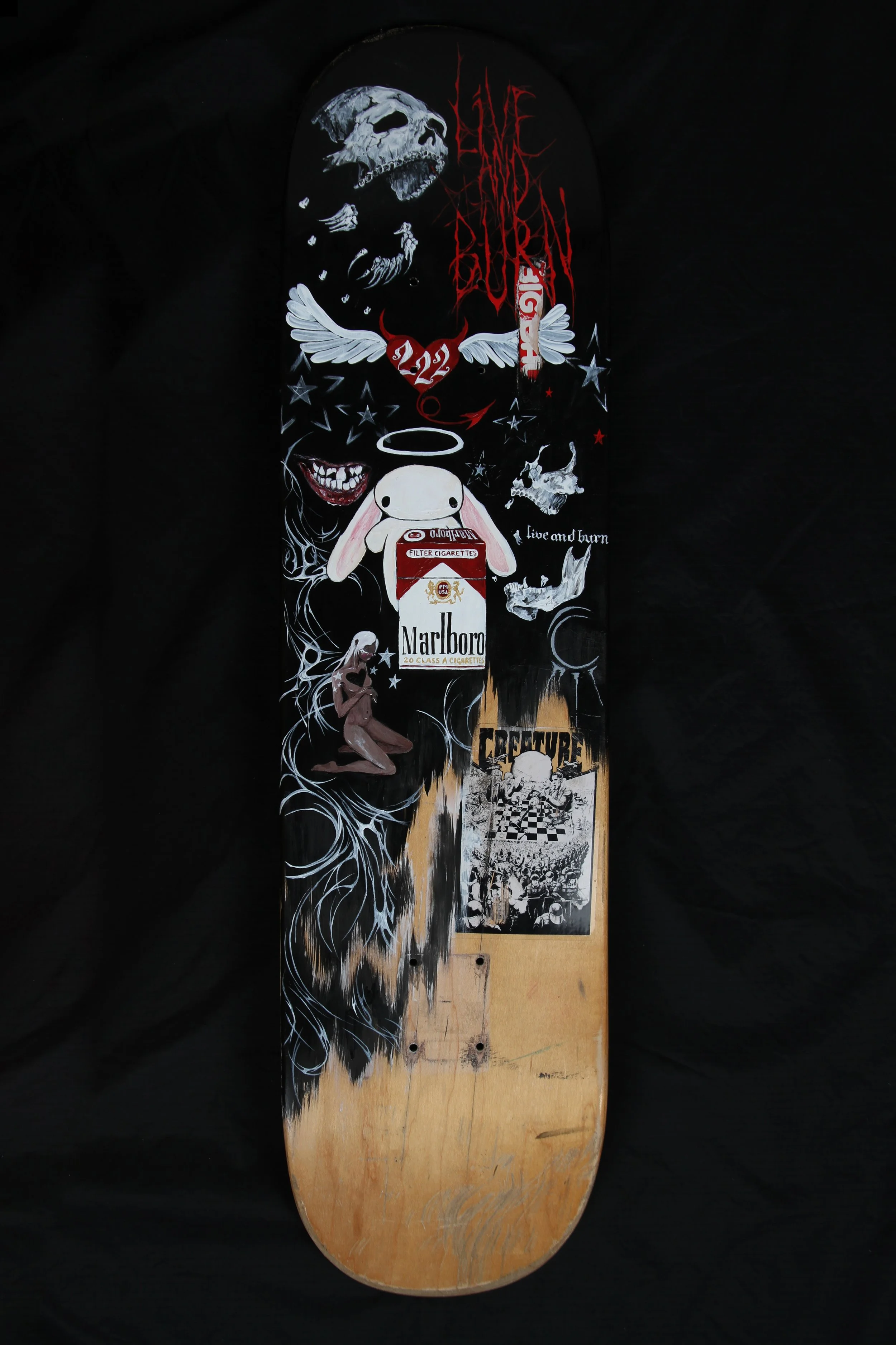 ' andy roy's teeth ' 2024. 8" x 28". reclaimed skateboard, acrylic paint.