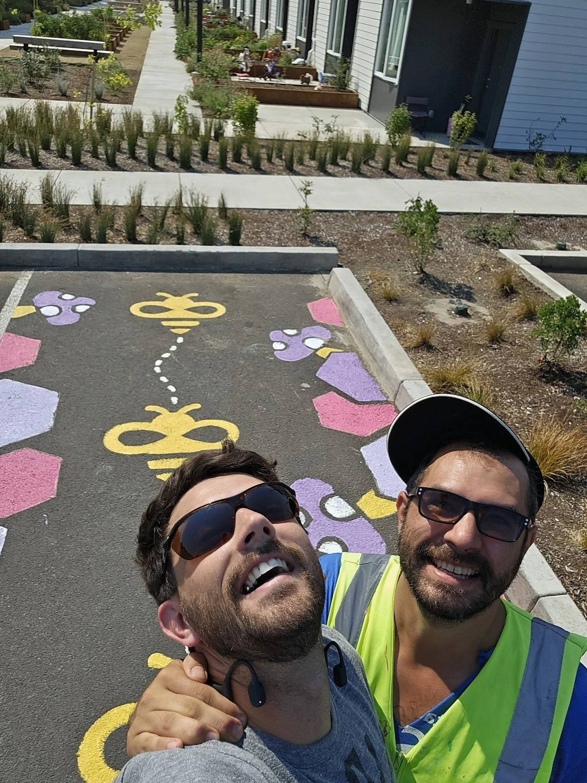 Peter and Kirk installing parking space murals