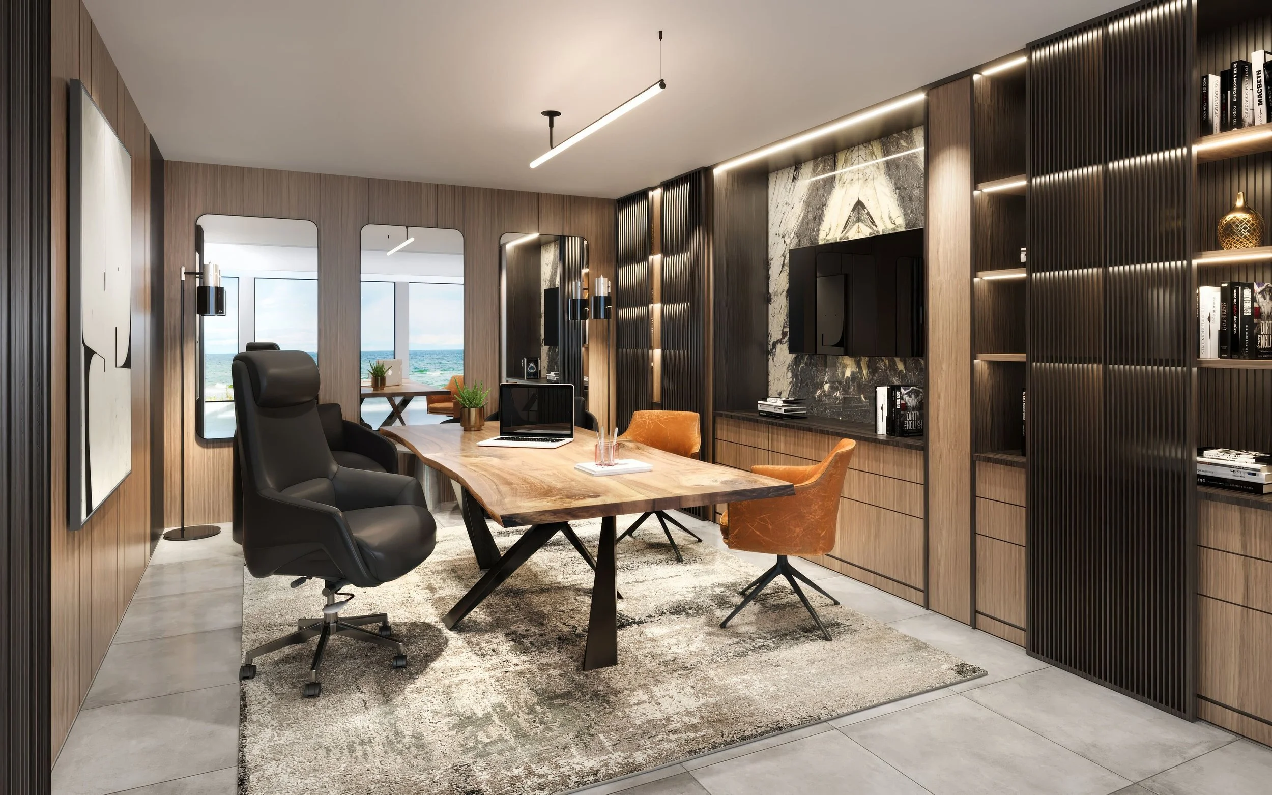 Modern office with a wooden table, black and tan chairs, built-in bookshelves, and a view of the ocean through large windows.