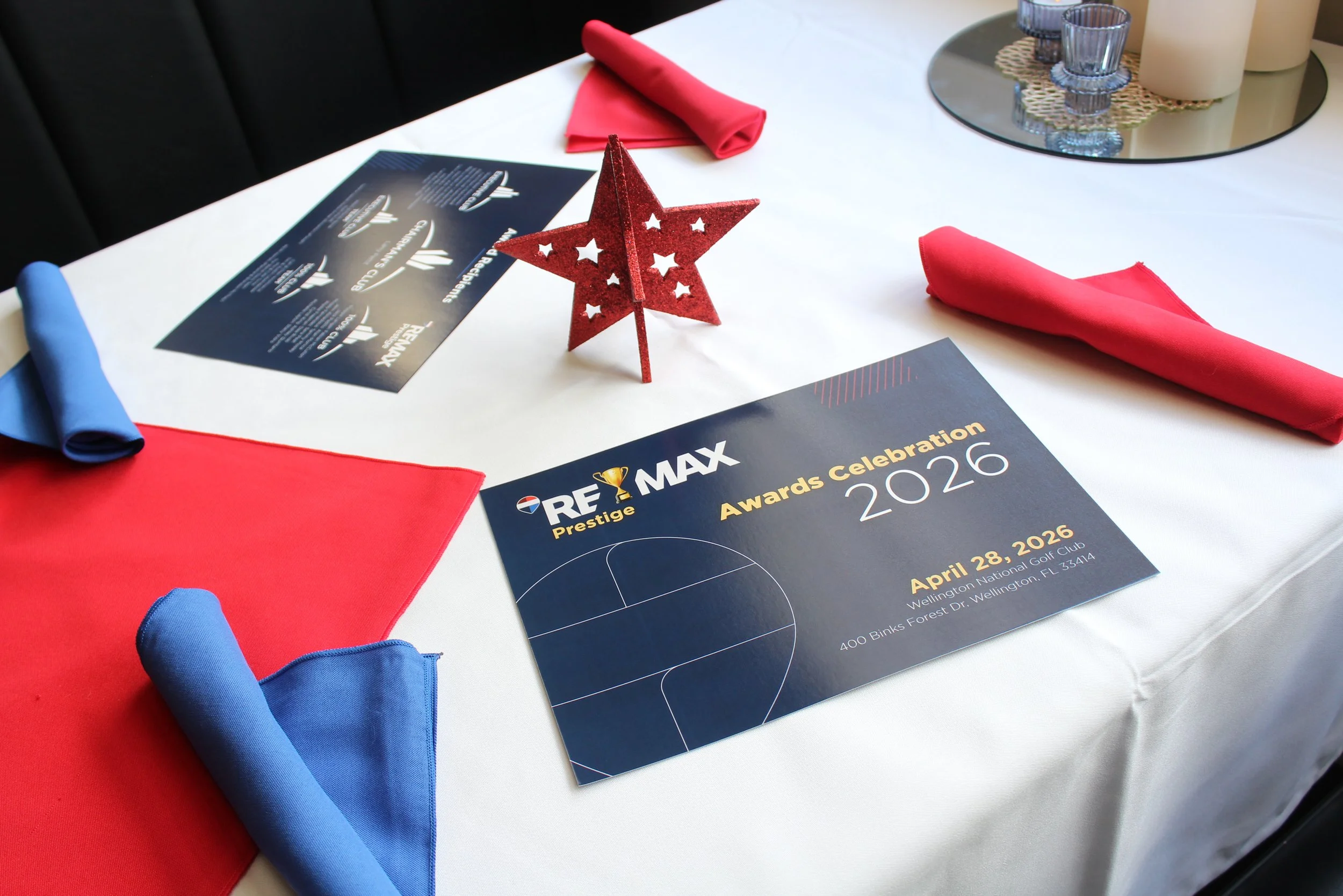 A photo of a double-sided flyer at an awards event hosted by the office (Print)