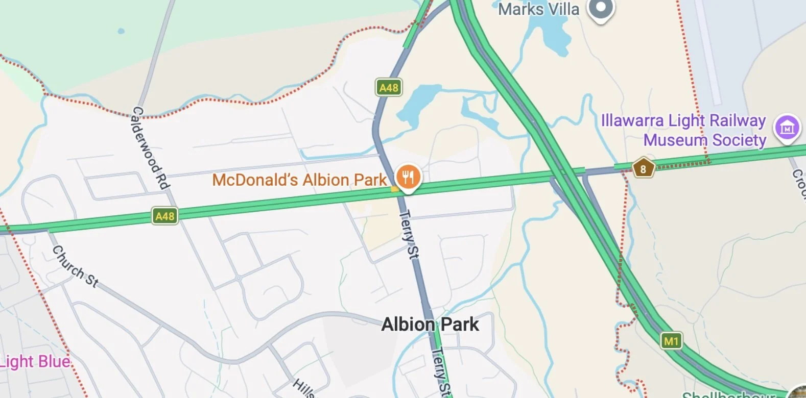 Map showing roads, highways, and landmarks around Albion Park, including McDonald's Albion Park, Illawarra Light Railway Museum Society, and main roads like A48 and M1.