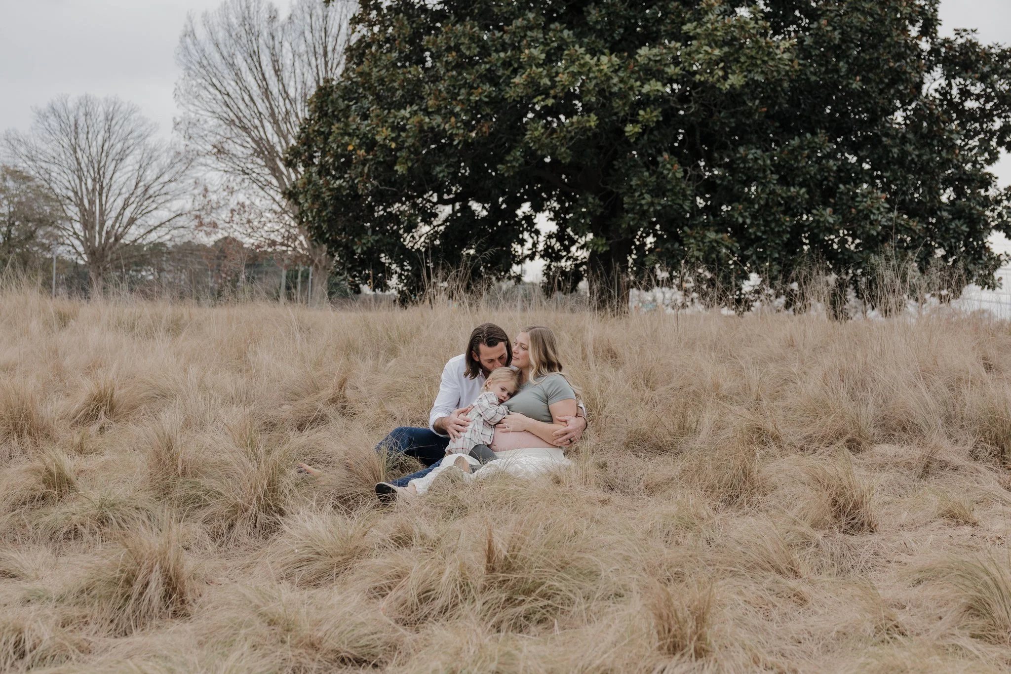  Soft, editorial maternity portrait taken in the fields of the North Carolina Museum of Art Park in Raleigh 